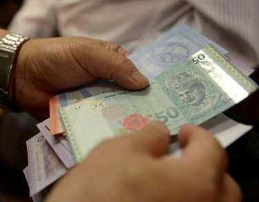 外国银行因马来西亚停止货币贬值而动摇